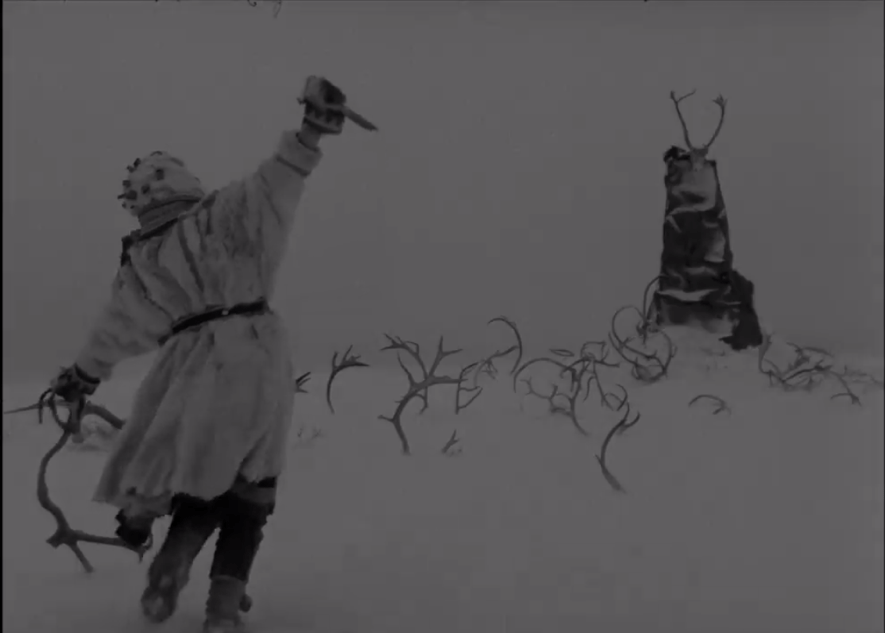 The White Reindeer: A Haunting Fairytale Experience 13 The White Reindeer: A Haunting Fairytale Experience A person in a garment holding a knife in the snow