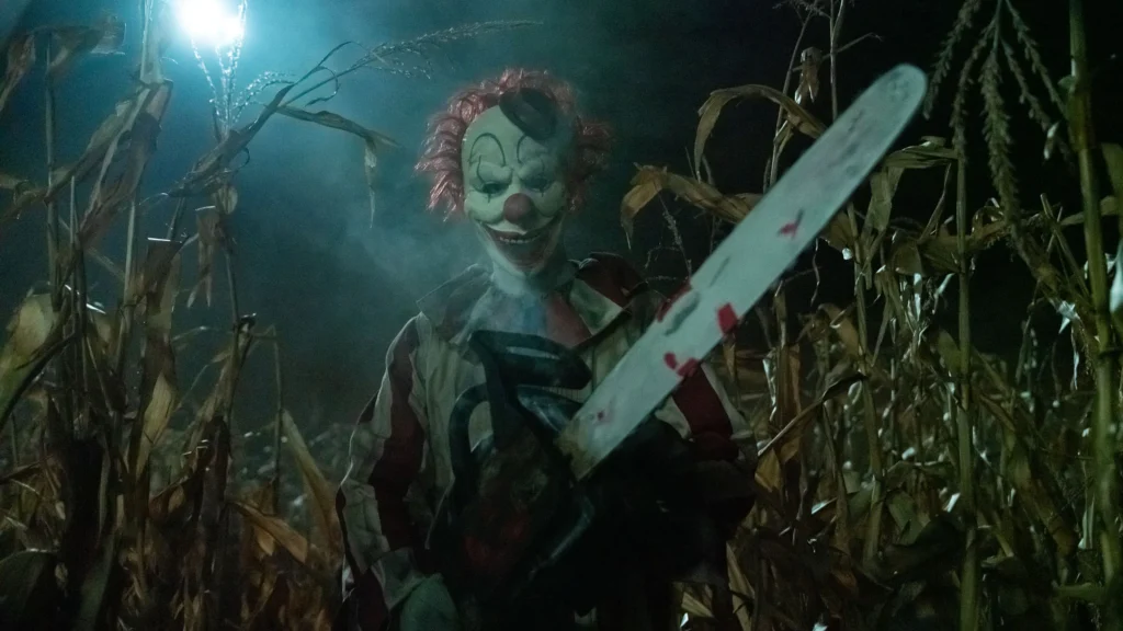 Clown in a Cornfield Movie Review: Blood, Gore, and Fun 2 Clown in a Cornfield Movie Review: Blood, Gore, and Fun Clown in a Cornfield
Horror Movie Review
Eli Craig
Movie Review
Adam Cesare
Clown in a Cornfield Review